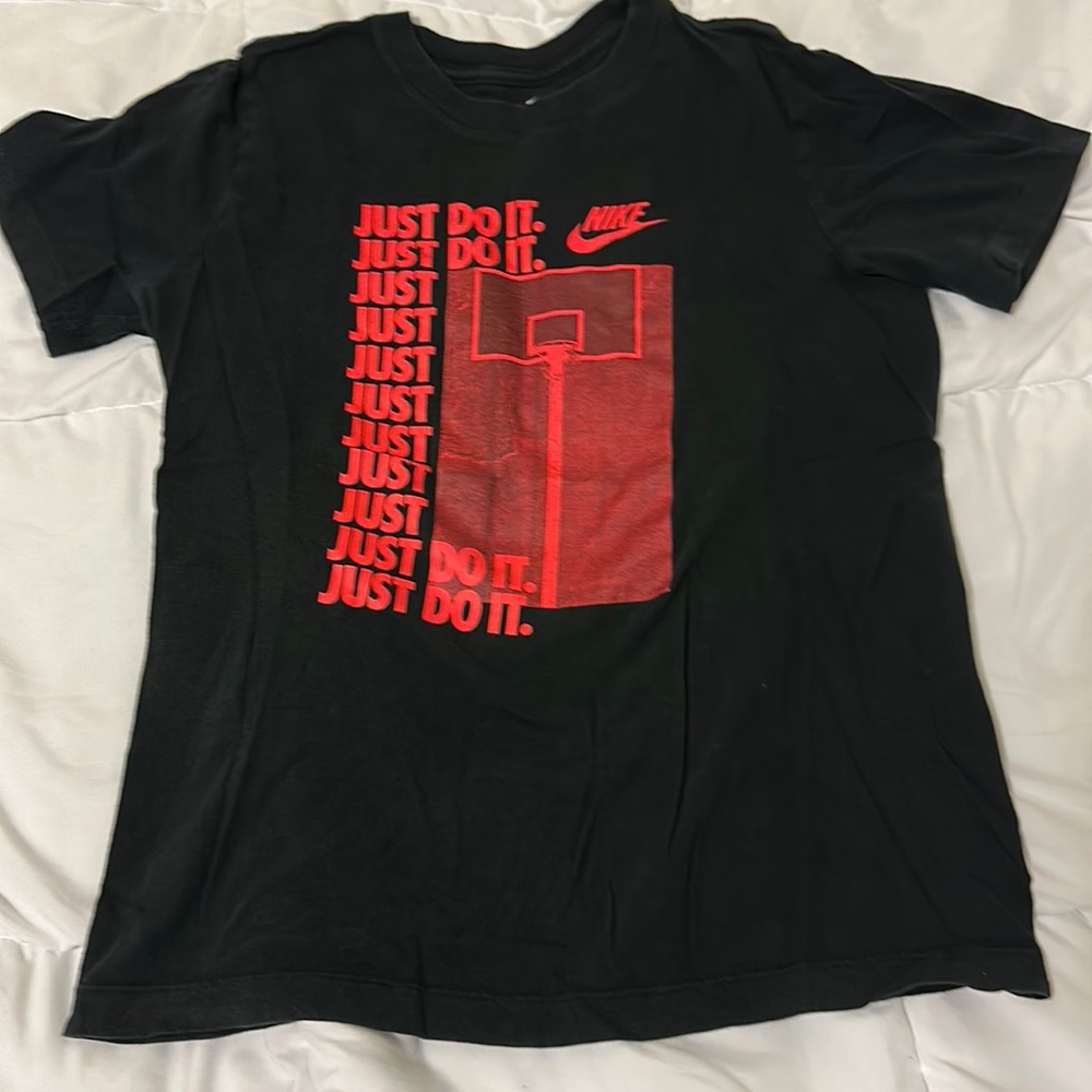 Black Nike tee with red design